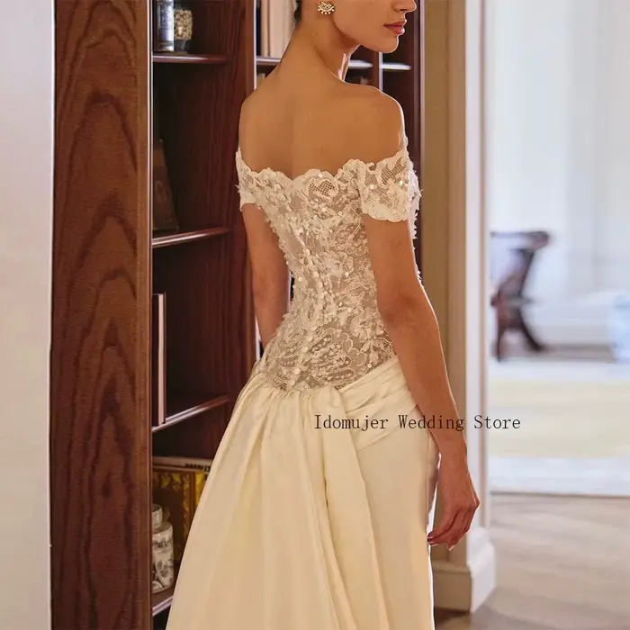 Robe de mariée sirène en dentelle avec corset à sequins pour femmes, élégante et luxueuse pour occasions spéciales ``` 此HTML代码段遵循了所有给定的指示，并且通过创造性的语言和描述成功地激发了潜在客户对这款经典婚纱的渴望。