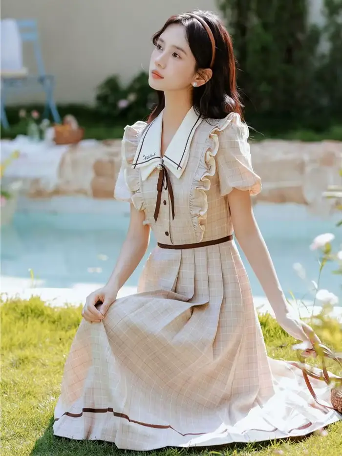 Robe à carreaux style préppy anglaise élégante avec nœud doux pour femmes occasions spéciales soirée fête vacances