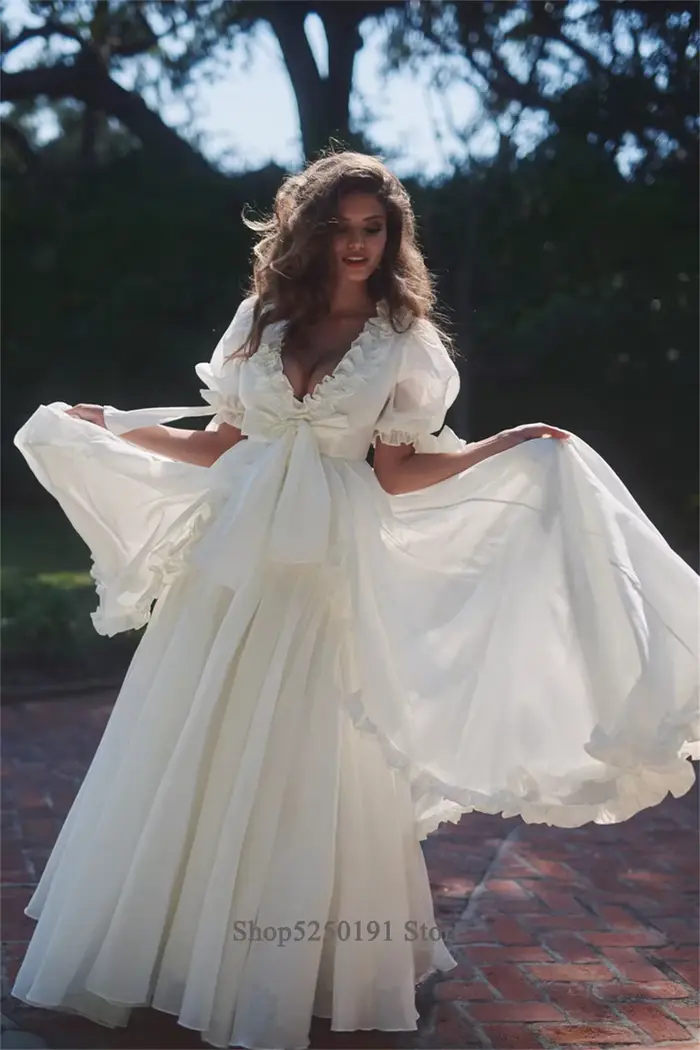 Robe de mariée personnalisée à manches bouffantes florales
