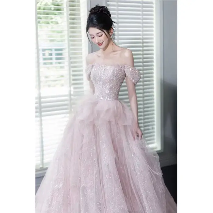 Robe de mariée rose à paillettes, jupe longue queue de poisson