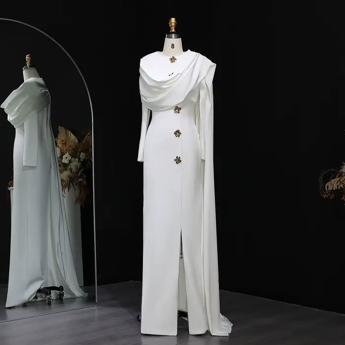 Robe de soirée sirène blanche arabe Sharon Said 2026, style Dubaï, avec cape et manches longues, pou