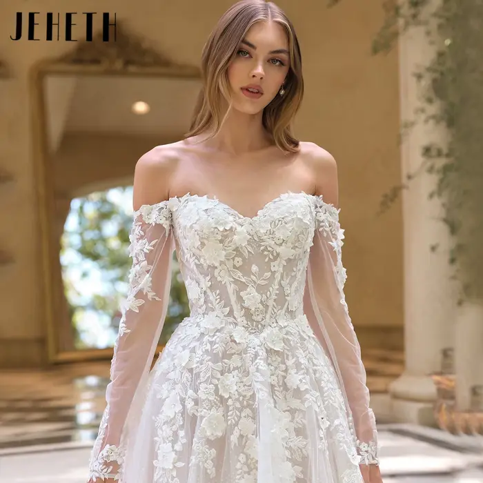 JEHETH Robe de Mariée Tulle Pailleté Coupe A Épaules Nues Col Bateau Manches Longues Transparentes Appliques Dentelle Florale 3D Dos Profond V Traîne Courte Shooting Villa Méditerranéenne Élégante