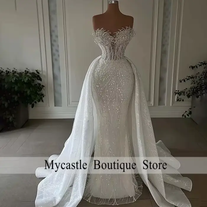 Robes de mariée sirène luxueuses 2026, sans bretelles, en dentelle lourdement perlée, 2 en 1 avec ju