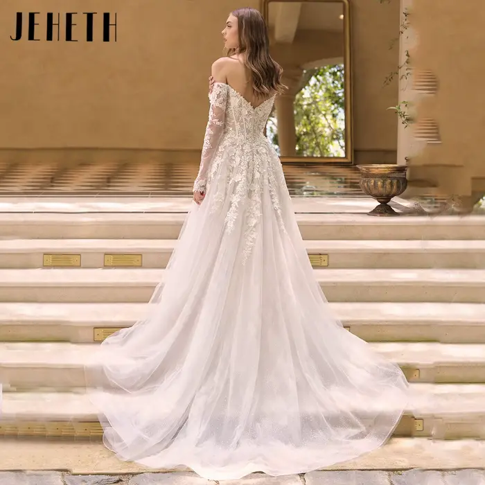 JEHETH Robe de Mariée Tulle Pailleté Coupe A Épaules Nues Col Bateau Manches Longues Transparentes Appliques Dentelle Florale 3D Dos Profond V Traîne Courte Shooting Villa Méditerranéenne Élégante