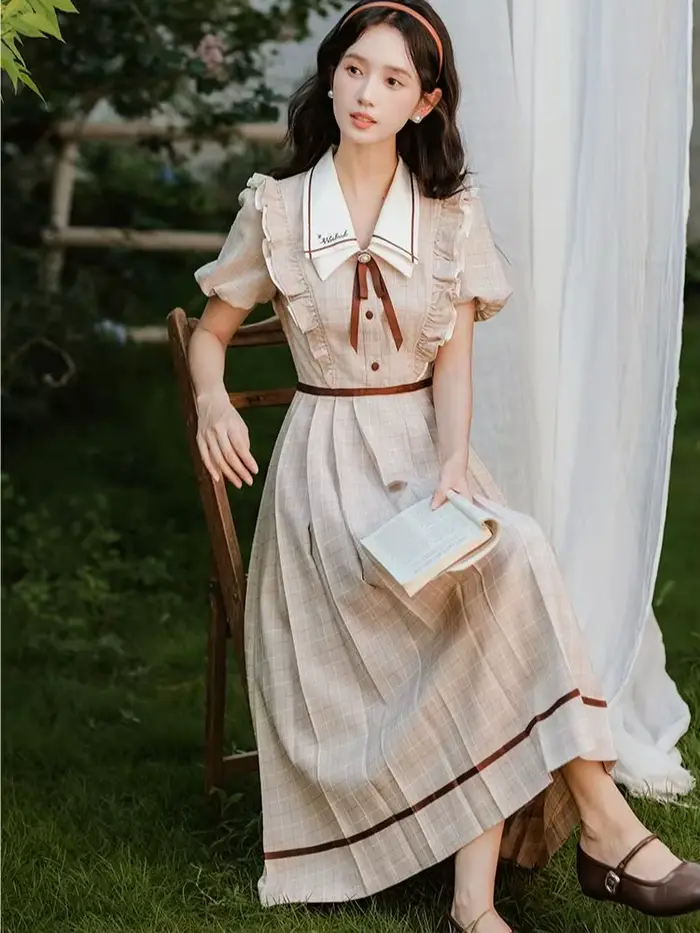 Robe à carreaux style préppy anglaise élégante avec nœud doux pour femmes occasions spéciales soirée fête vacances