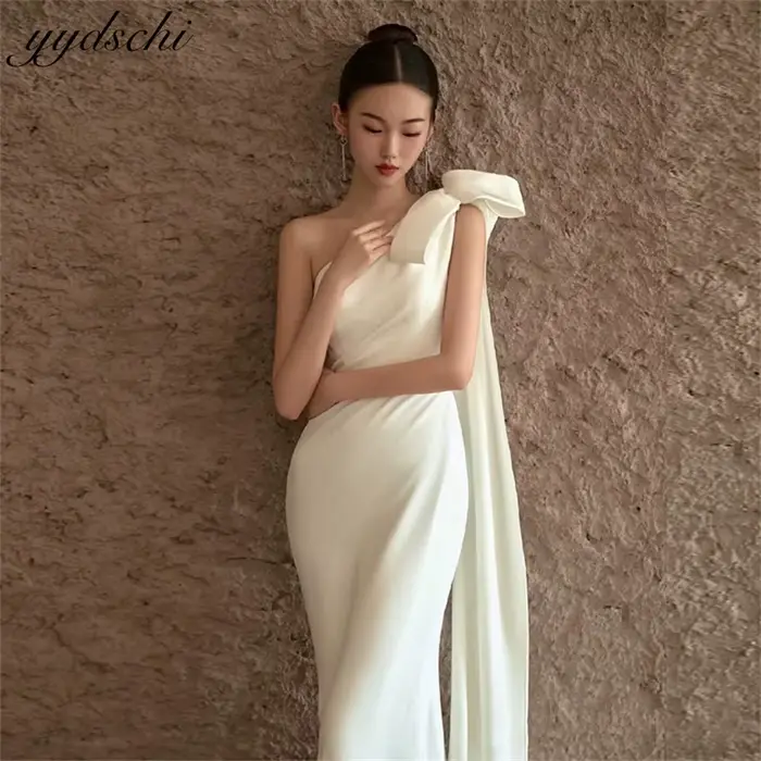 Robes de mariée sirène élégantes asymétriques sans manches avec nœud en satin pour femmes 2026
