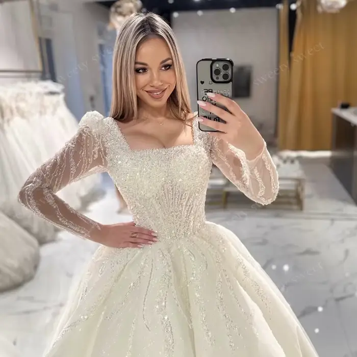 Robe de Mariée ShaLaYIi Trapèze Luxe Brodée Perles Manches Longues Col Carré Train Couronne Occasions Spéciales