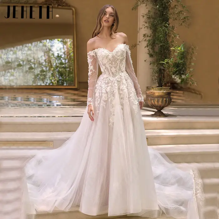 JEHETH Robe de Mariée Tulle Pailleté Coupe A Épaules Nues Col Bateau Manches Longues Transparentes Appliques Dentelle Florale 3D Dos Profond V Traîne Courte Shooting Villa Méditerranéenne Élégante