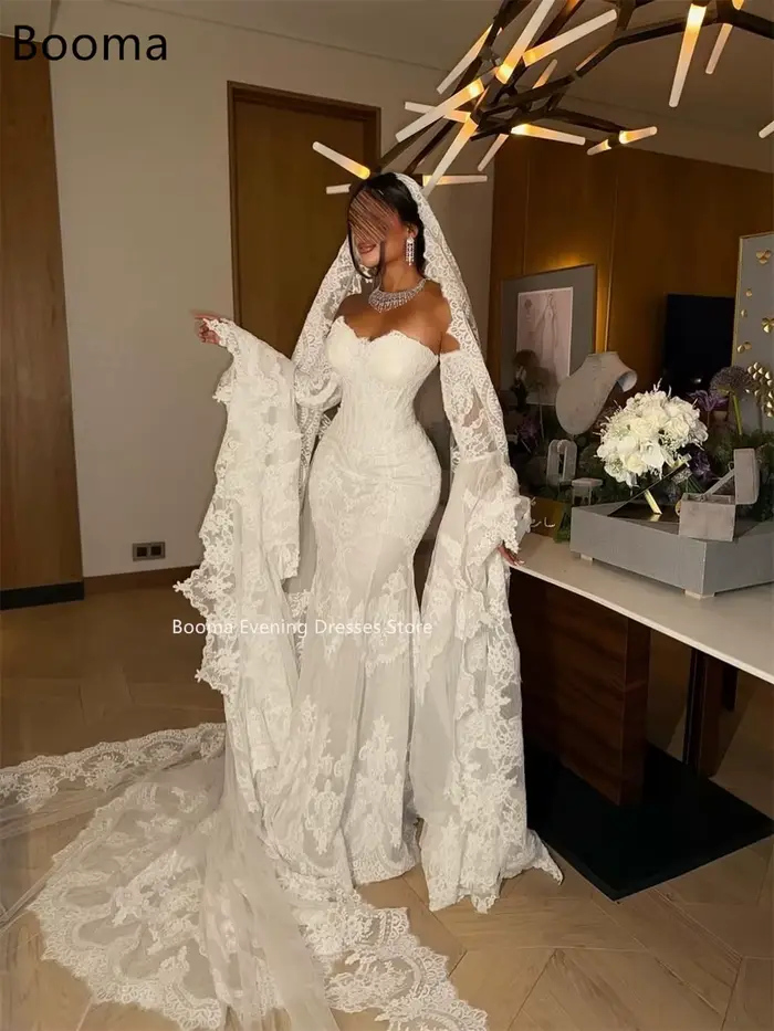 Robe de mariée sirène en dentelle ivoire style hors de l'épaule avec coupe trompette et longueur au sol pour mariage élégant