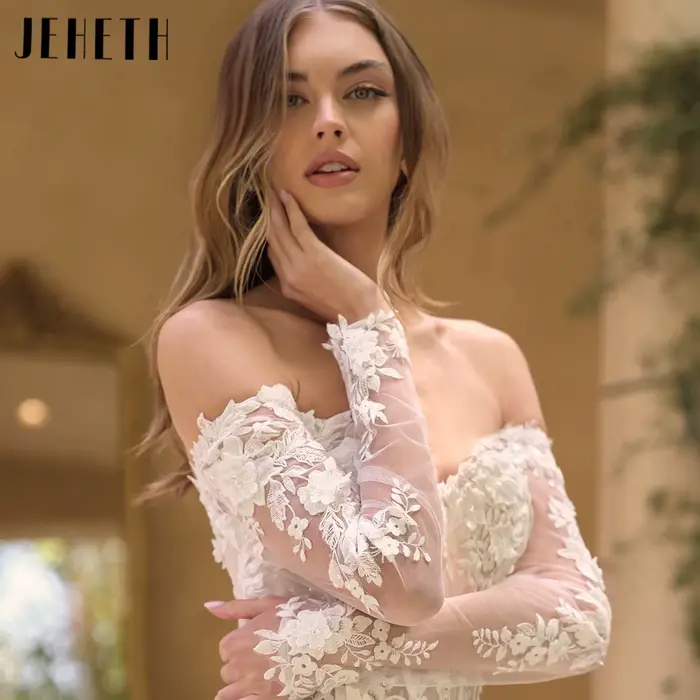 JEHETH Robe de Mariée Tulle Pailleté Coupe A Épaules Nues Col Bateau Manches Longues Transparentes Appliques Dentelle Florale 3D Dos Profond V Traîne Courte Shooting Villa Méditerranéenne Élégante