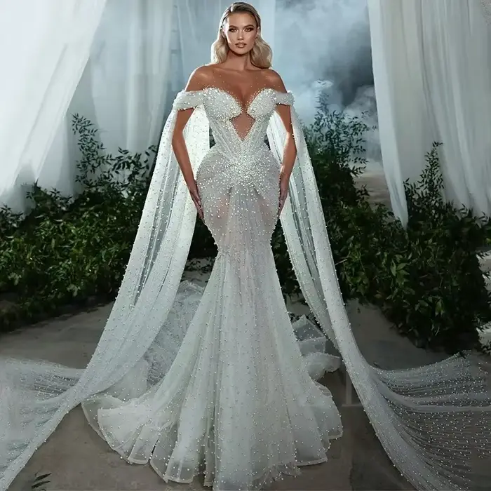 Robe de mariée sirène de luxe entièrement ornée de perles