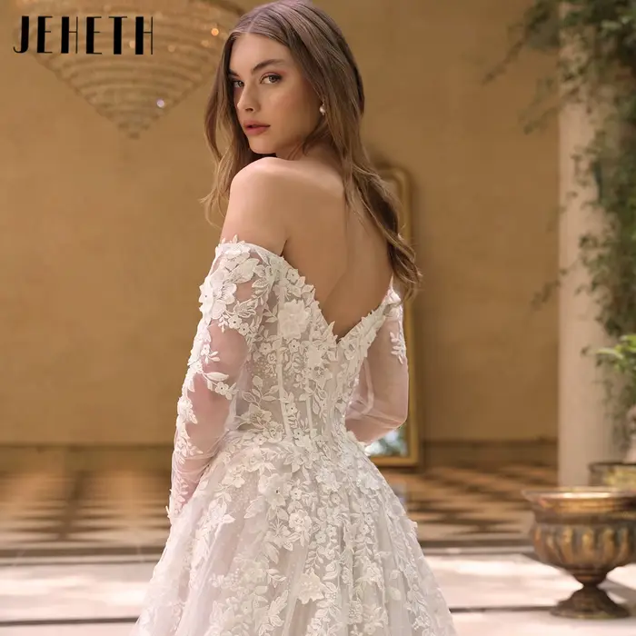 JEHETH Robe de Mariée Tulle Pailleté Coupe A Épaules Nues Col Bateau Manches Longues Transparentes Appliques Dentelle Florale 3D Dos Profond V Traîne Courte Shooting Villa Méditerranéenne Élégante
