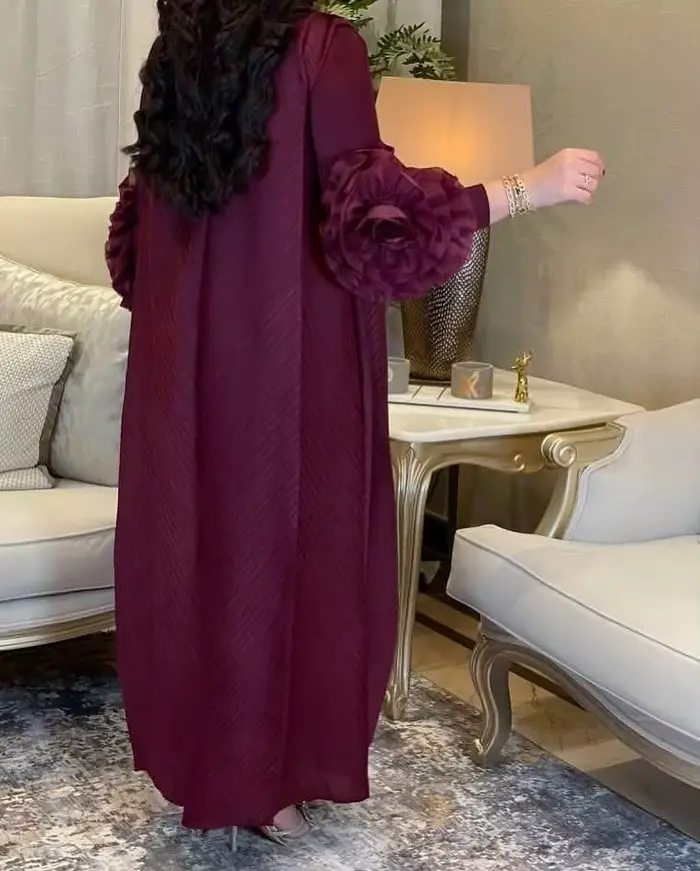Femmes élégantes robes de soirée 2025 été nouvelle couleur unie classique à manches longues plaque fleur conception