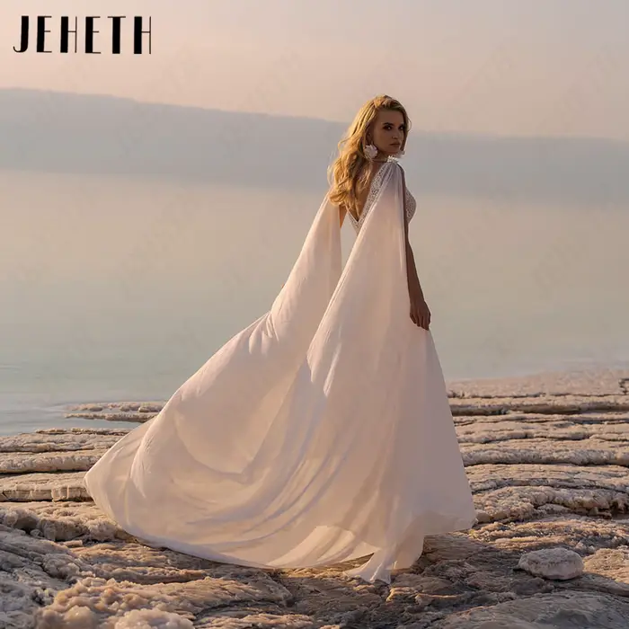 JEHETH Robe de Mariée Bohème Sans Manches Mousseline Coupe A Sur Mesure Col V Profond Dos Nu Appliques Dentelle Taille Découpée Jupe Longue Flottante Mariage Plage Shooting Coucher de Soleil Bord de M