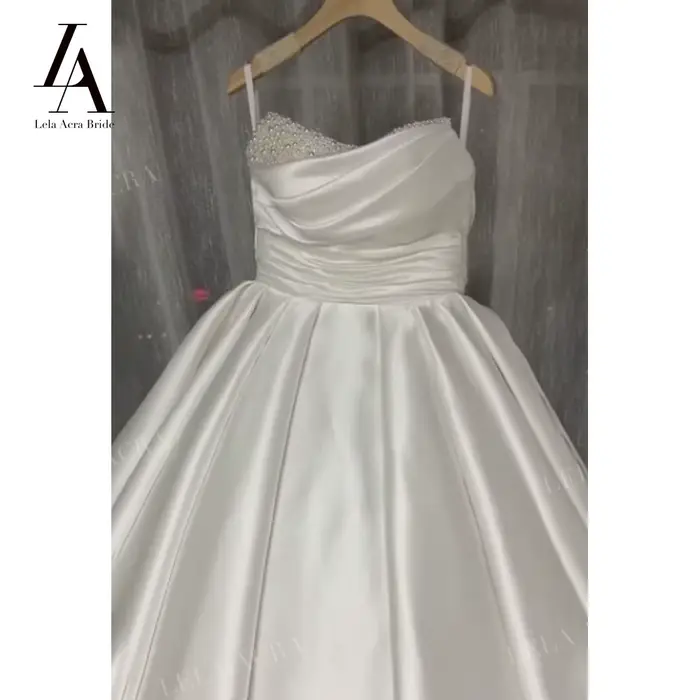 Magnifique robe de mariée en perles 2026 Satin sans manches