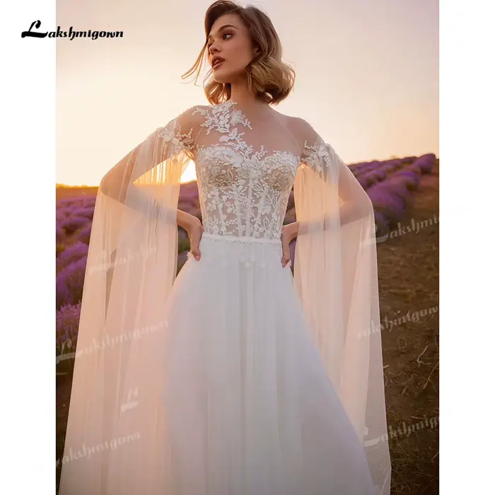 Robe de mariée élégante en dentelle coupe A-line style bohème, avec tulle illusion, appliques floral