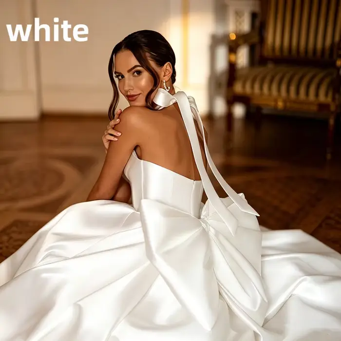 Robe de Mariée Satin Col Licou Grand Nœud Dos Nu Train Chapelle Robe Princesse Luxe Minimaliste 2026