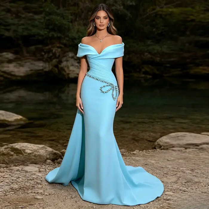 Robe de soirée bleue formelle avec décolleté épaules dénudées, corsage structuré, détail nœud en cri