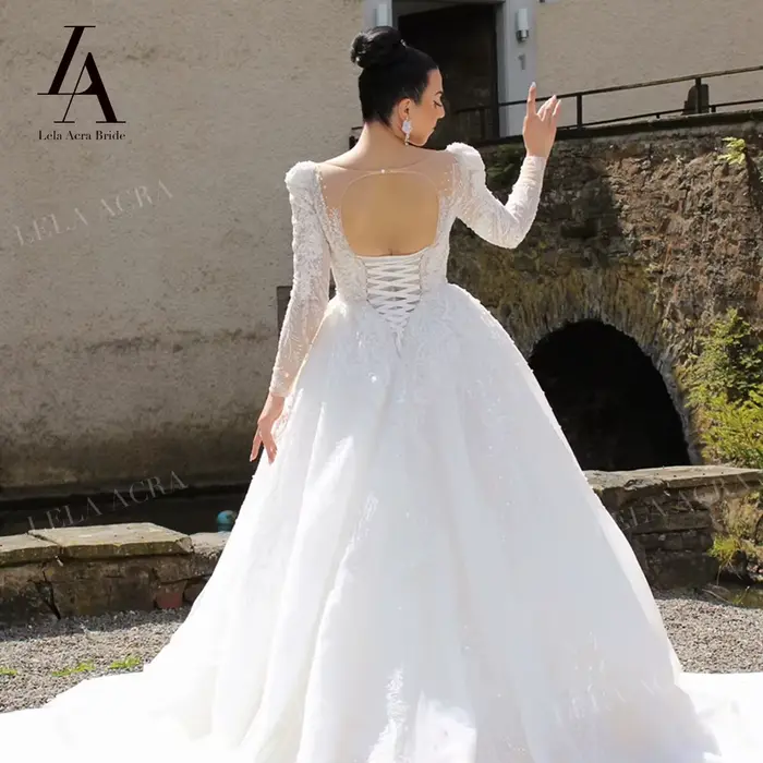 Robe de mariée trapèze à manches longues