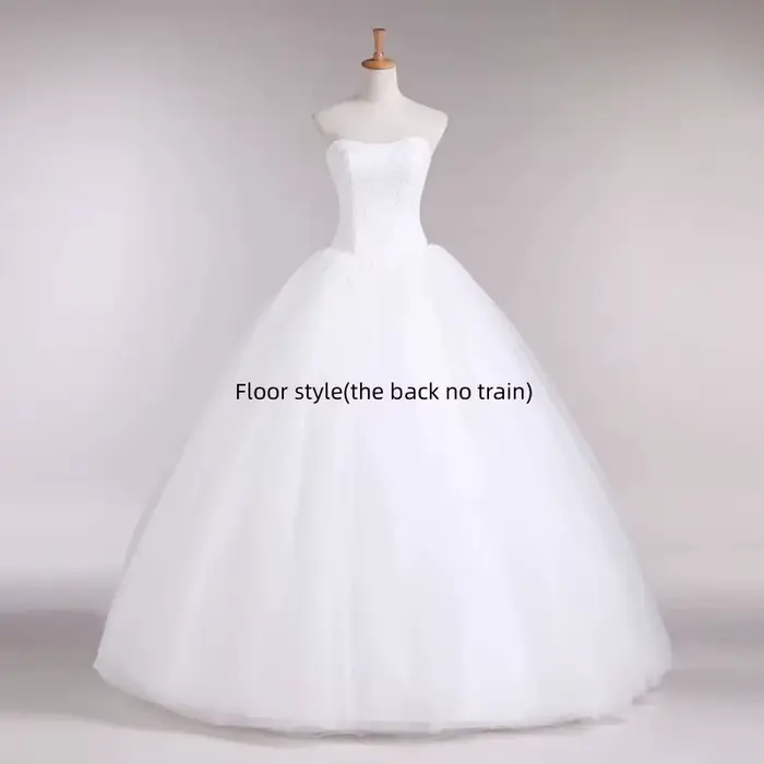 Robe de mariée ivoire sans bretelles à lacets