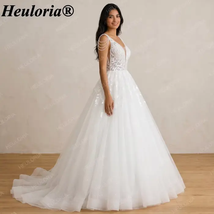Robe de mariée élégante Heuloria à col en V profond avec appliques en dentelle, épaules à franges de perles, robe de mariée en tulle coupe A-line avec effet illusion, Co