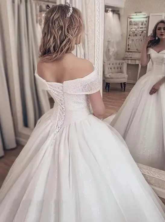 Robe de mariée princesse en paillettes ivoire