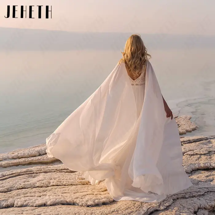 JEHETH Robe de Mariée Bohème Sans Manches Mousseline Coupe A Sur Mesure Col V Profond Dos Nu Appliques Dentelle Taille Découpée Jupe Longue Flottante Mariage Plage Shooting Coucher de Soleil Bord de M