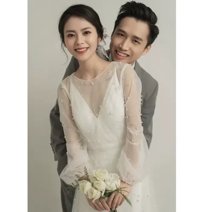 Robe de mariée blanche à manches longues