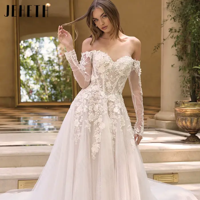 JEHETH Robe de Mariée Tulle Pailleté Coupe A Épaules Nues Col Bateau Manches Longues Transparentes Appliques Dentelle Florale 3D Dos Profond V Traîne Courte Shooting Villa Méditerranéenne Élégante