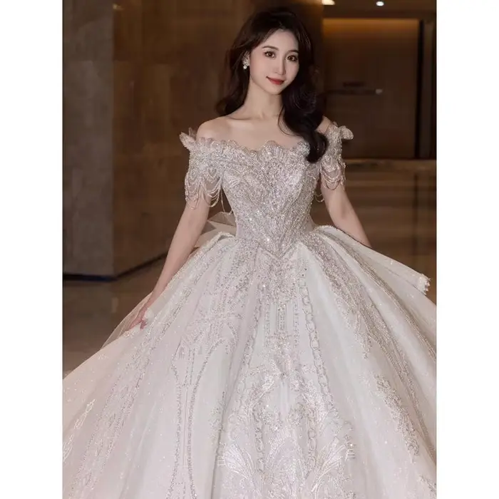 Robe de mariée asymétrique épaule dénudée en dentelle, avec franges françaises, princesse mariée, industrie lourde, broderie de perles, robe de fiançailles personnalisée