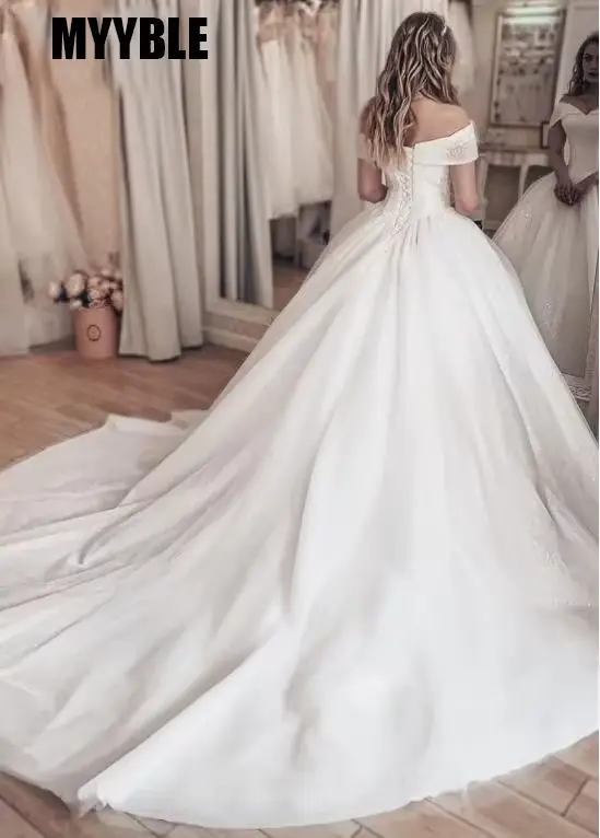 Robe de mariée princesse en paillettes ivoire